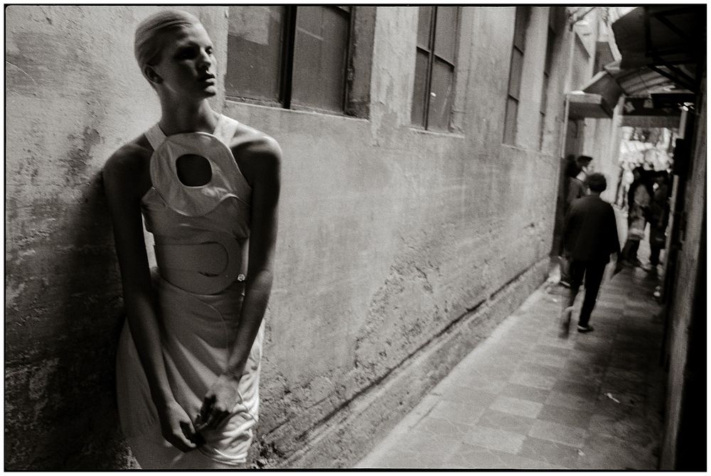 A series of black and white street photographs showing narrow alleyways and architectural details in Venice, Italy.