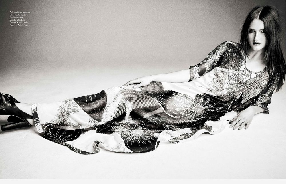 A series of black and white artistic photographs showing a figure in flowing fabric creating ethereal movement.