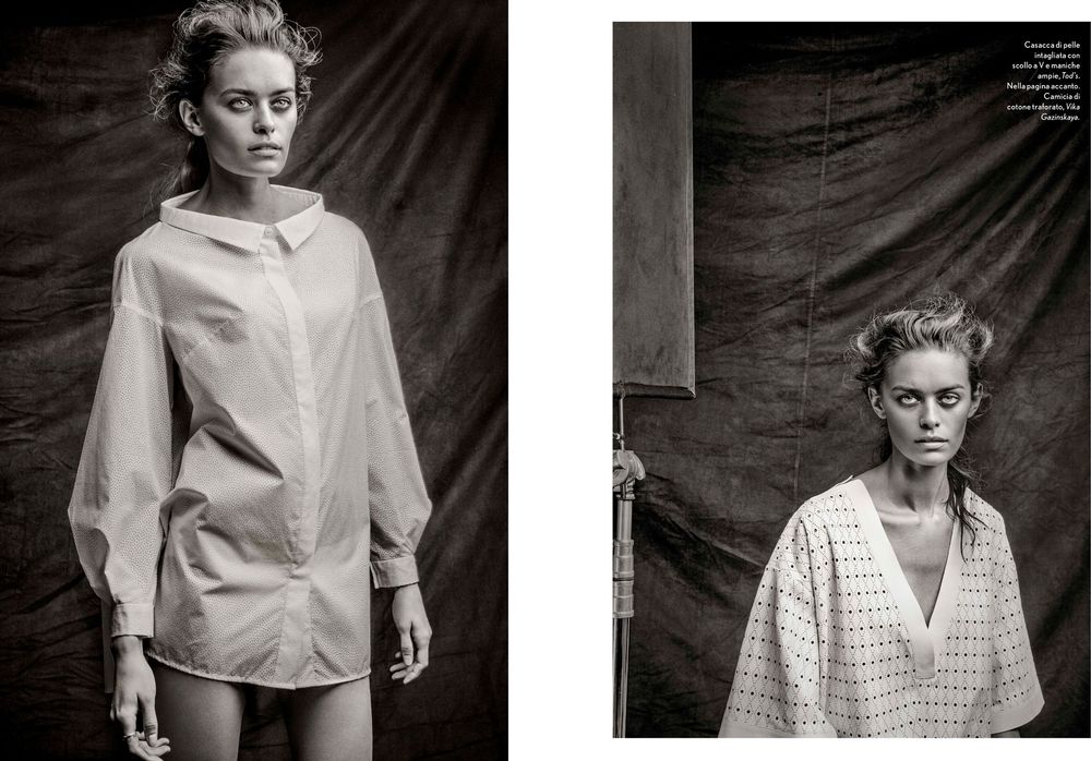 Black and white fashion photography series featuring dramatic lighting and minimalist white clothing against dark backdrop.