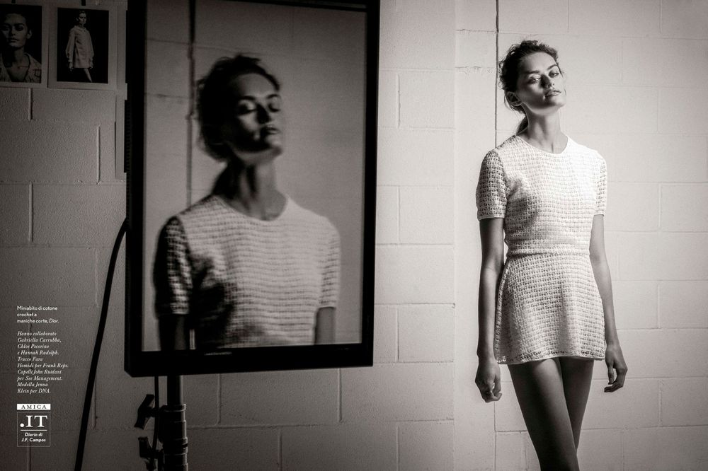 A black and white photo collage shows seven artistic portraits displayed in sequence against a white wall.