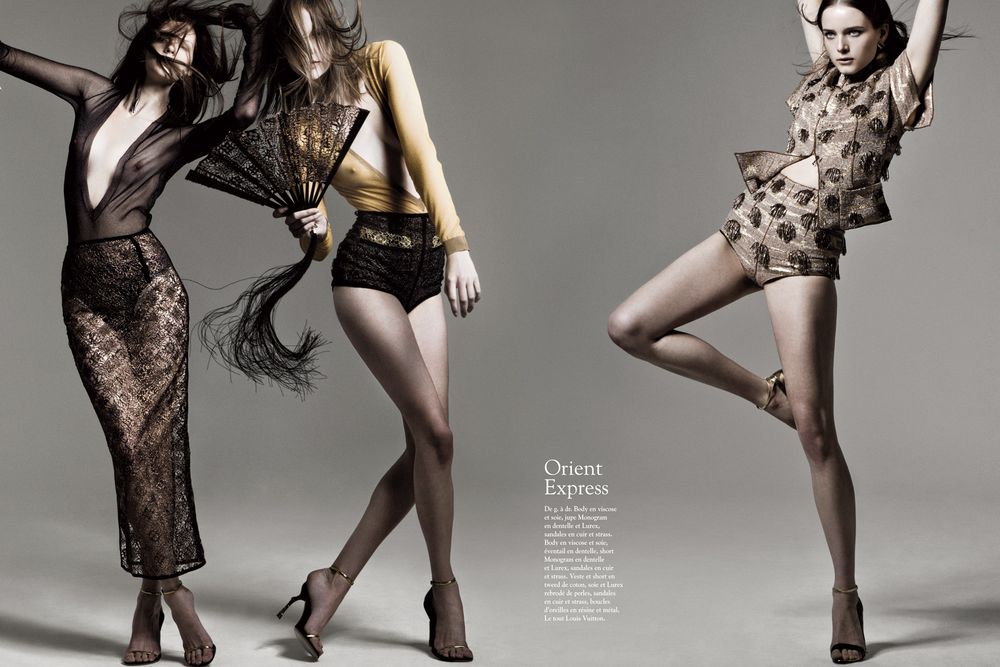 Fashion models pose in artistic black lace and patterned bodysuits against neutral studio backdrop.