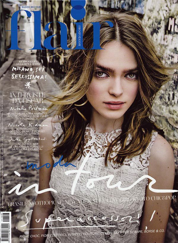 Magazine cover design featuring artistic typography and high contrast black and white photography with lace details.