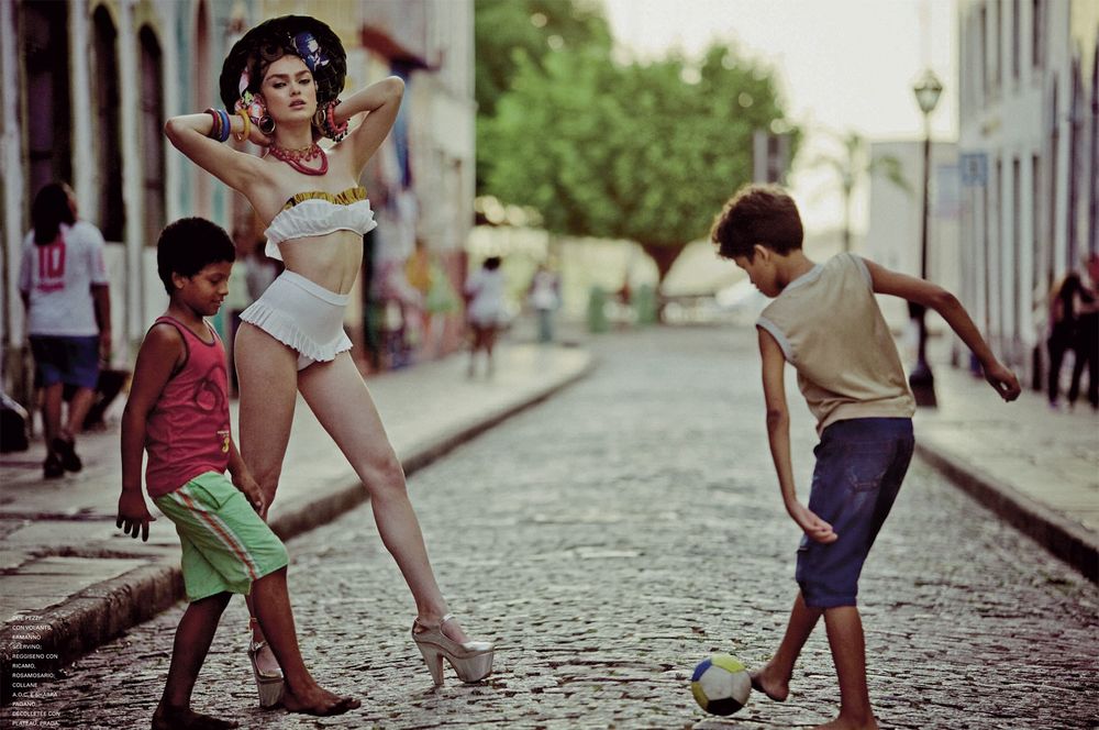 A series of vintage-style photos showing someone playing with a paper airplane on a cobblestone street.