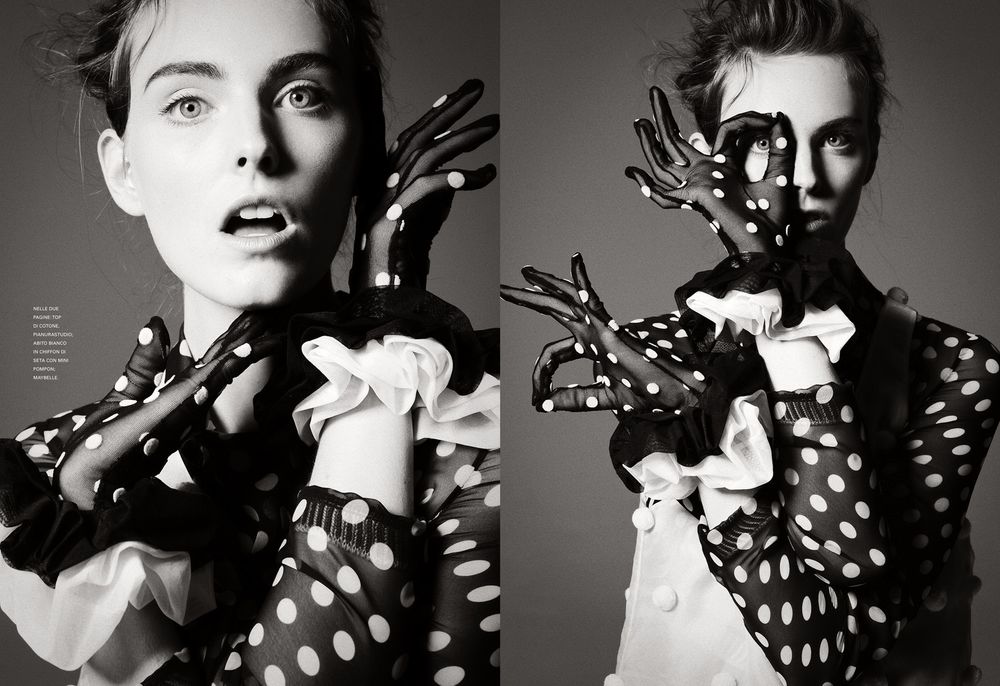Black and white fashion editorial featuring dramatic lighting and polka dot pattern shadows cast across the subject.