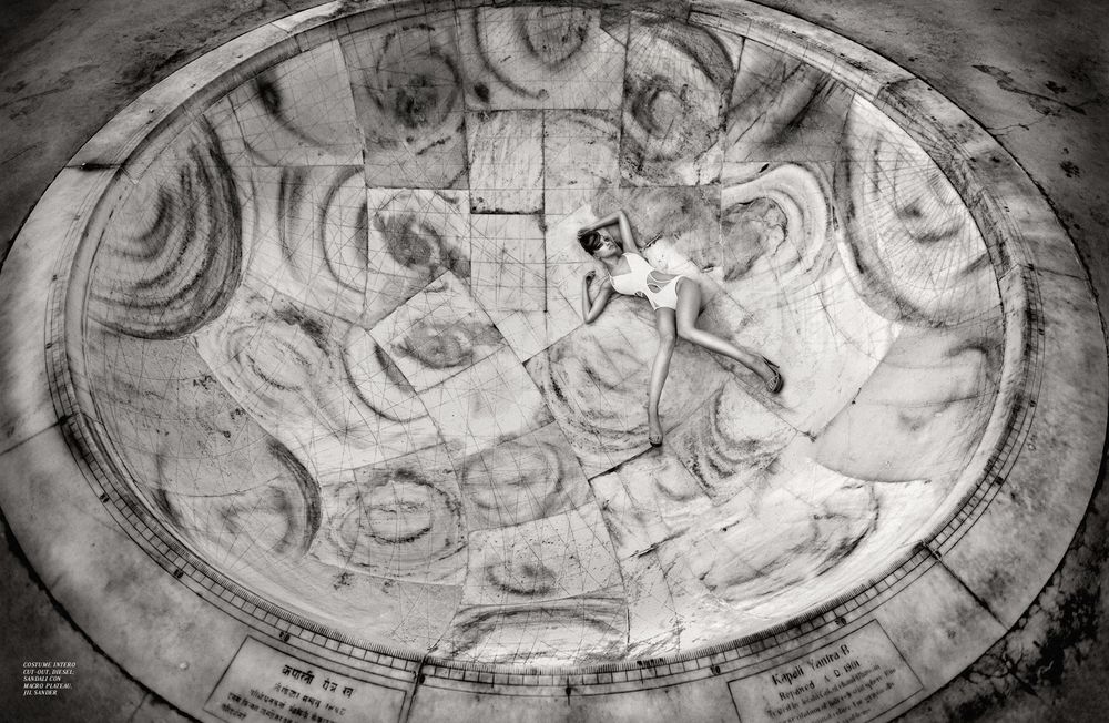 Black and white photograph of an ancient religious fresco painted on a domed ceiling showing celestial figures.
