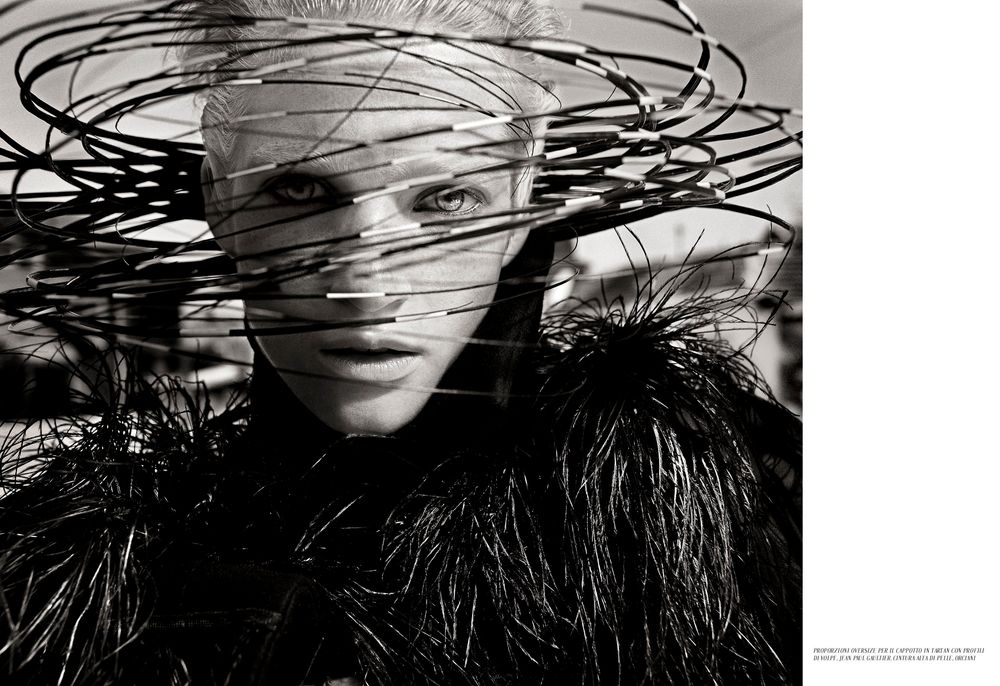 Abstract black and white composition with overlapping scribbled lines creating a dynamic pattern.