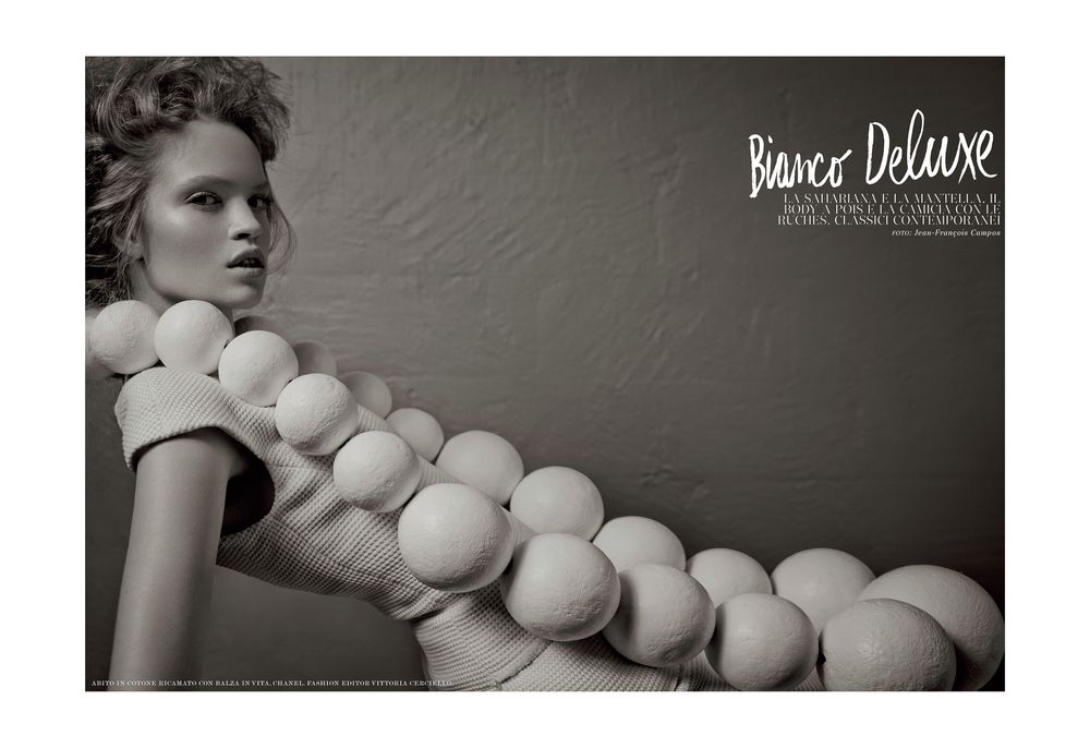 Artistic black and white photography series featuring spherical white balloons against dark backgrounds.
