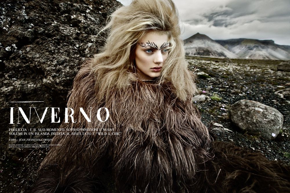 Dramatic fashion editorial photo shoot in moody winter landscape with windswept styling and dark atmosphere.