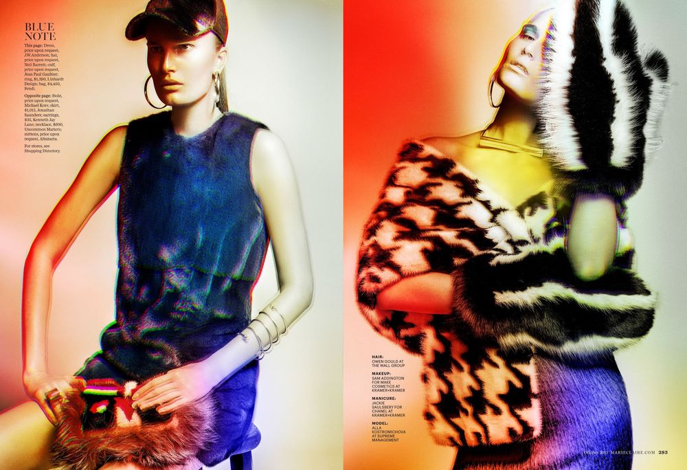 Fashion model poses in colorful gradient lighting wearing dark clothing against vibrant red and blue backgrounds.