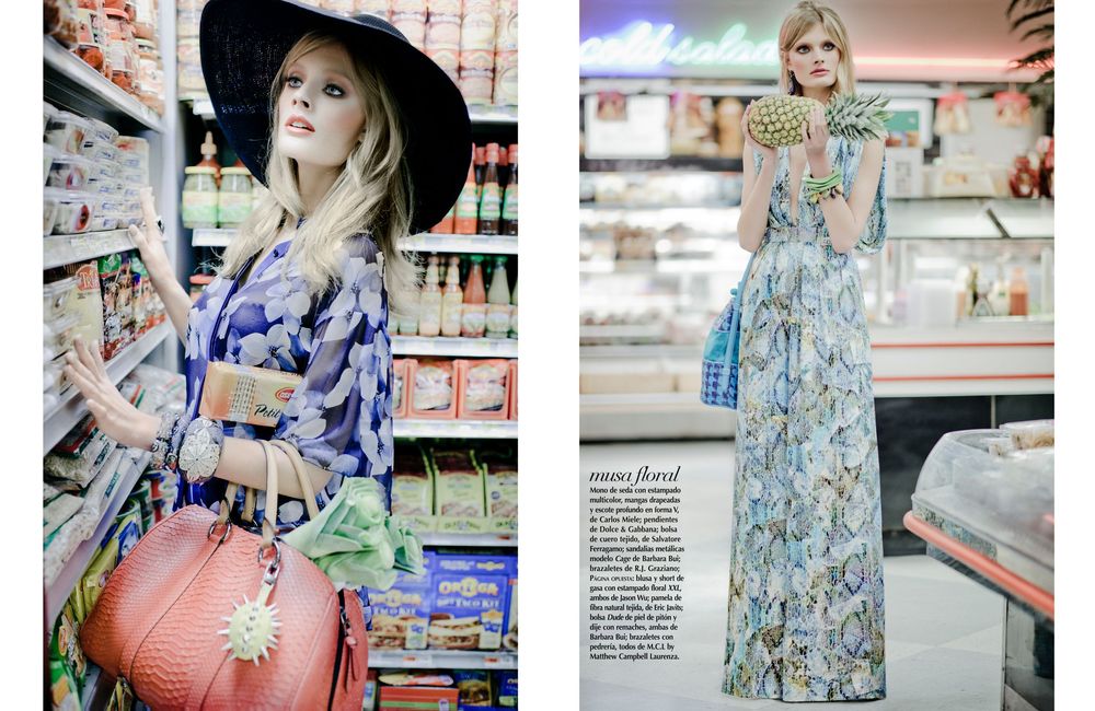 A person in a floral dress browses products in a convenience store aisle with pink and blue lighting.