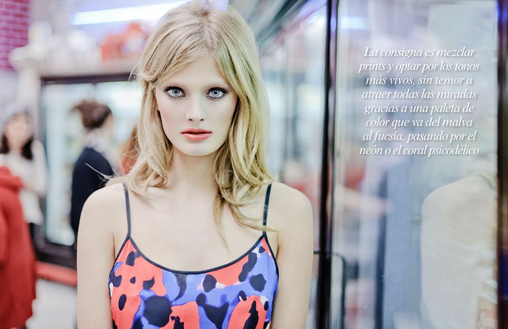 A series of fashion photos showing a model in a blue and coral patterned dress against various urban backgrounds.