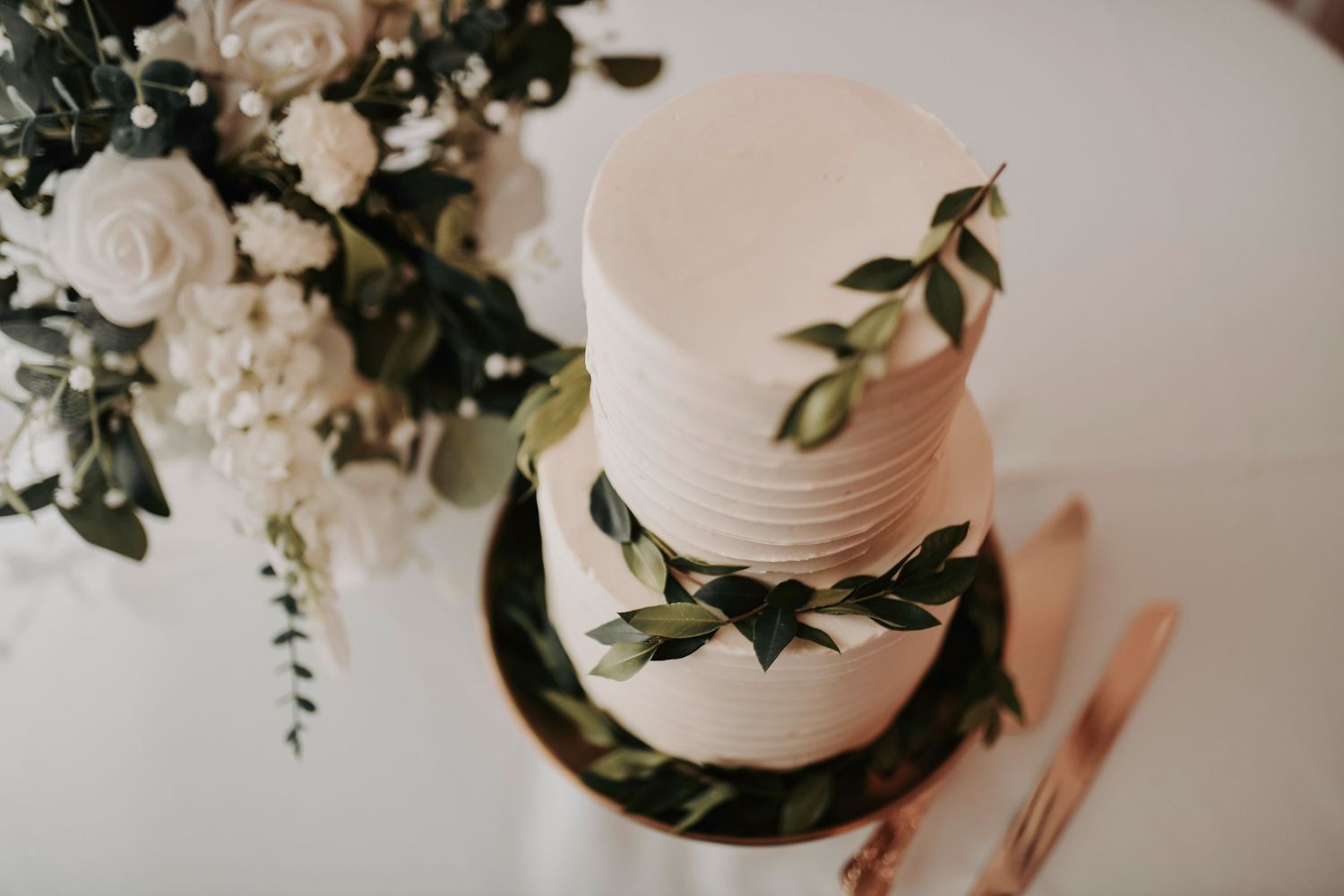 Wedding cake decorated with soft greenery details