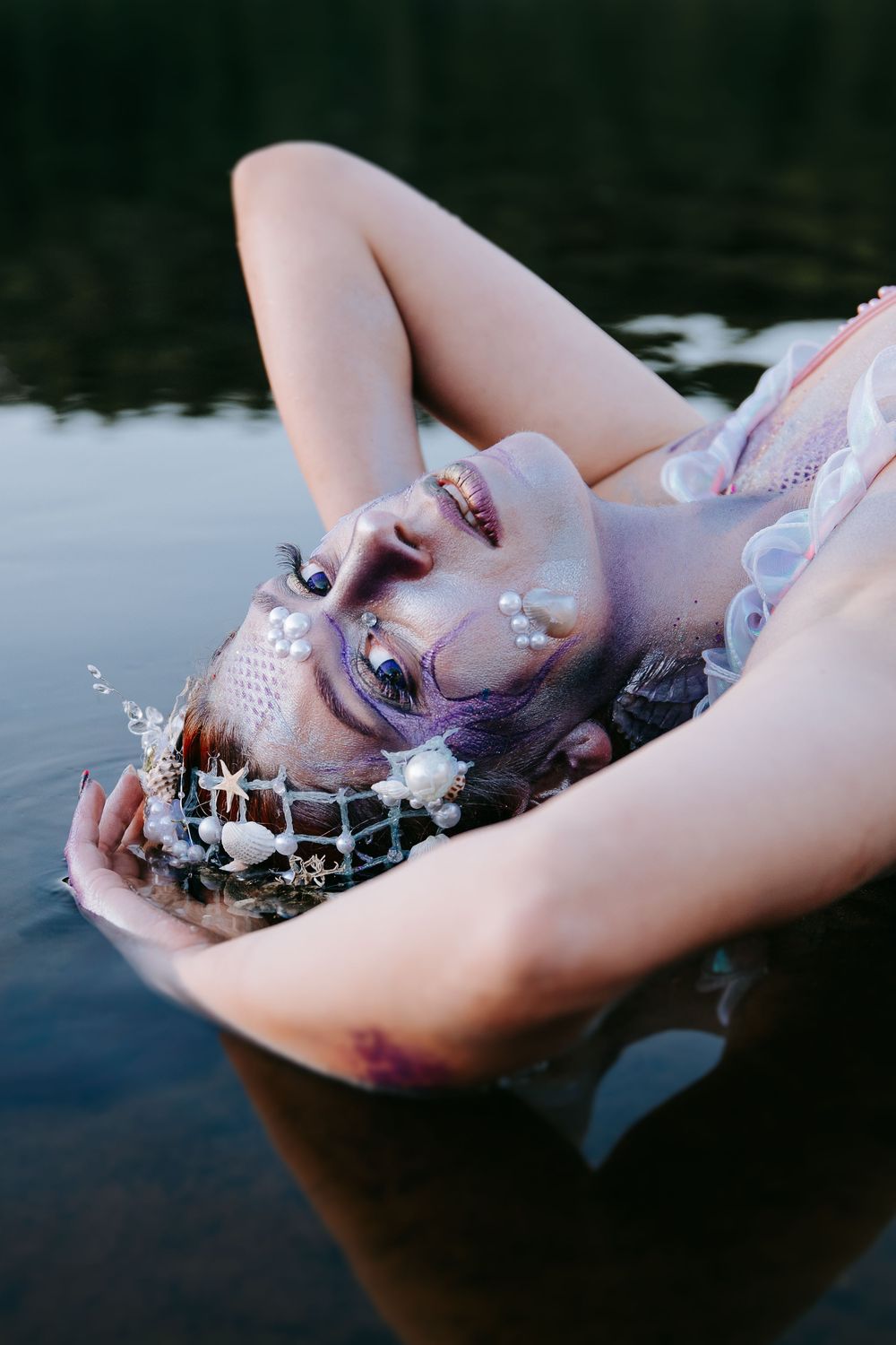 A series of artistic underwater portraits showing ethereal floating poses with delicate bubbles and reflections.