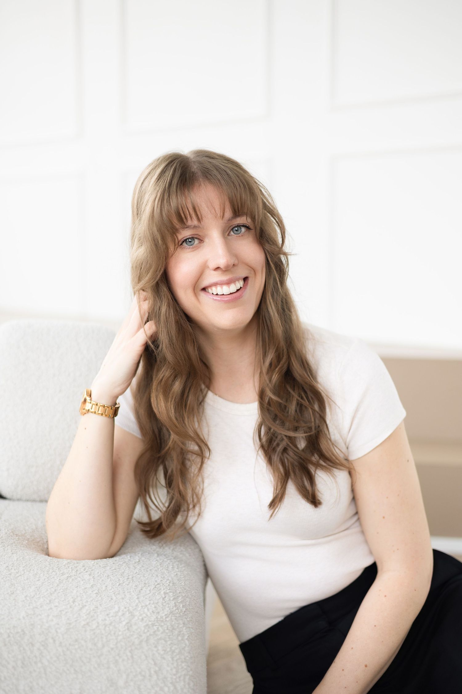 Female entrepreneur in a cream shirt during a personal branding photoshoot in London, Ontario, styled for a modern and professional look.