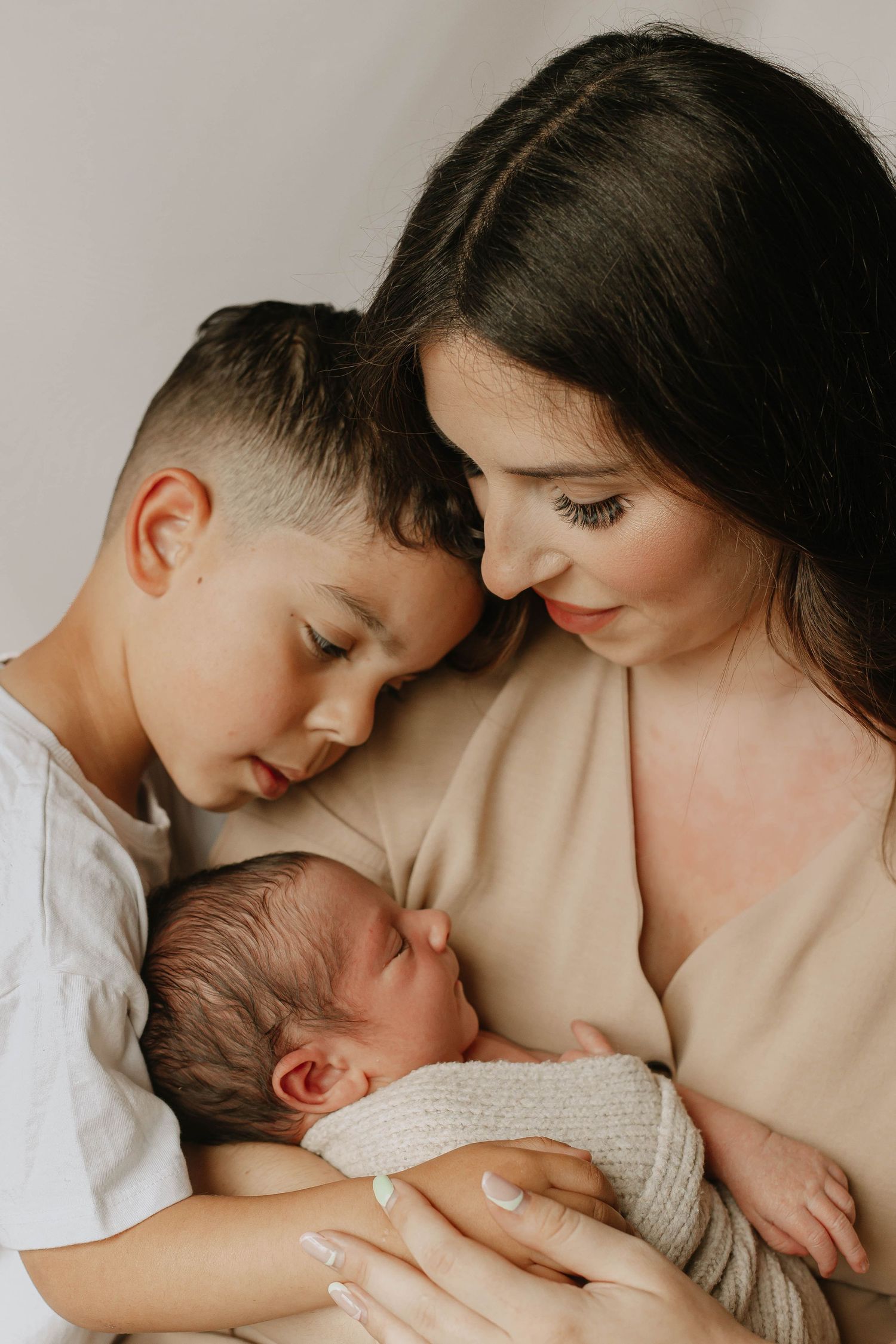 Mother with two children during in home newborn photoshoot in Ashford Kent