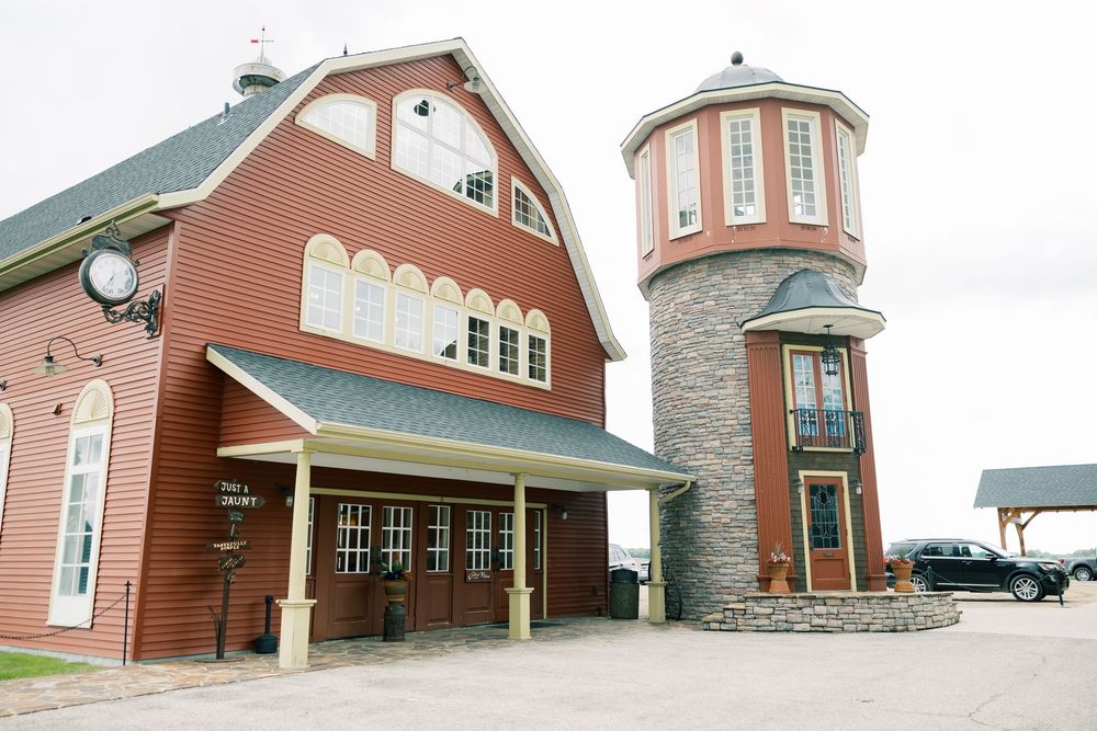 Exterior building shots showcase multi-story residential buildings with angular rooflines and warm brick facades.