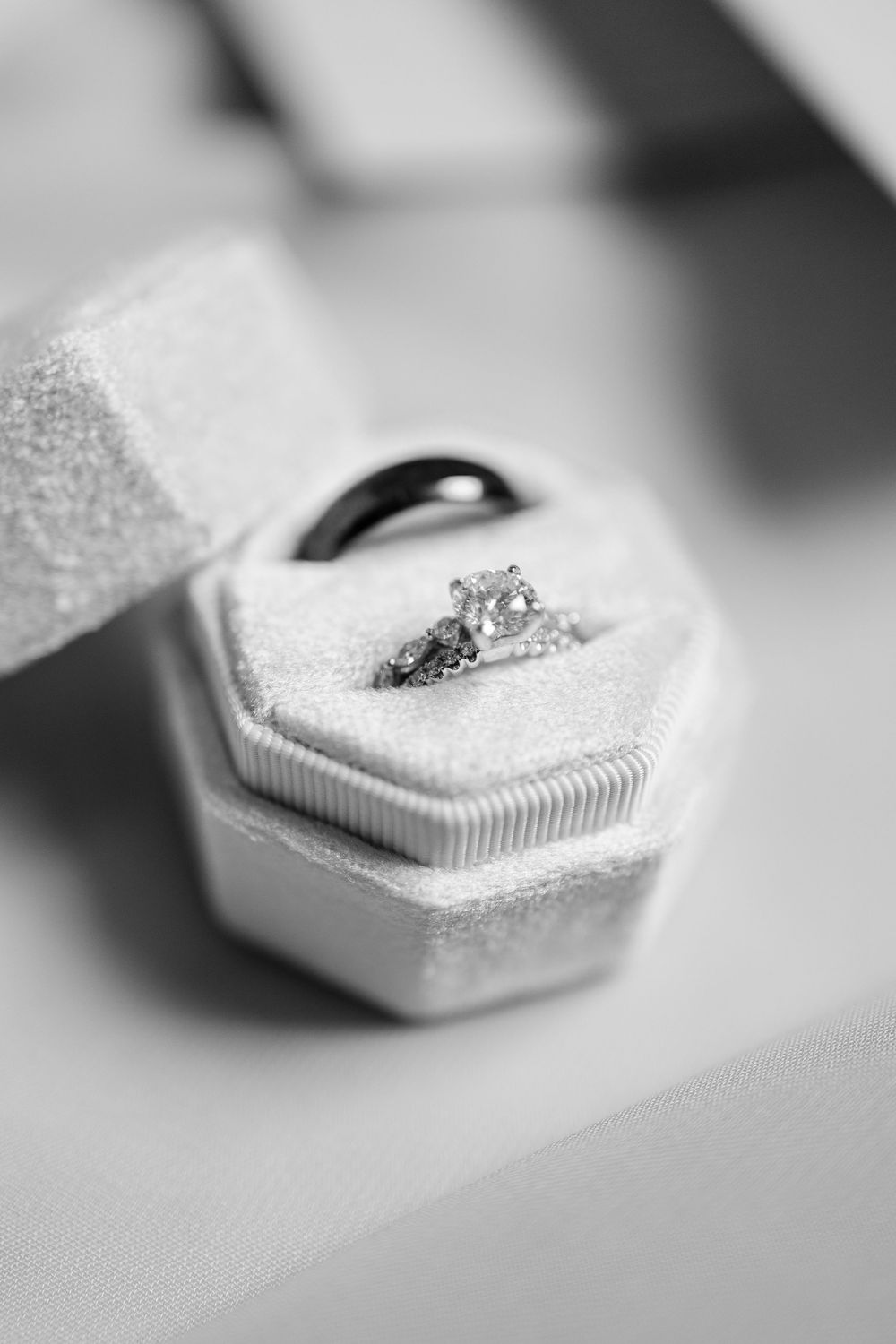 Macro detail shots of silver and gold cuff links with ornate surfaces in black and white.