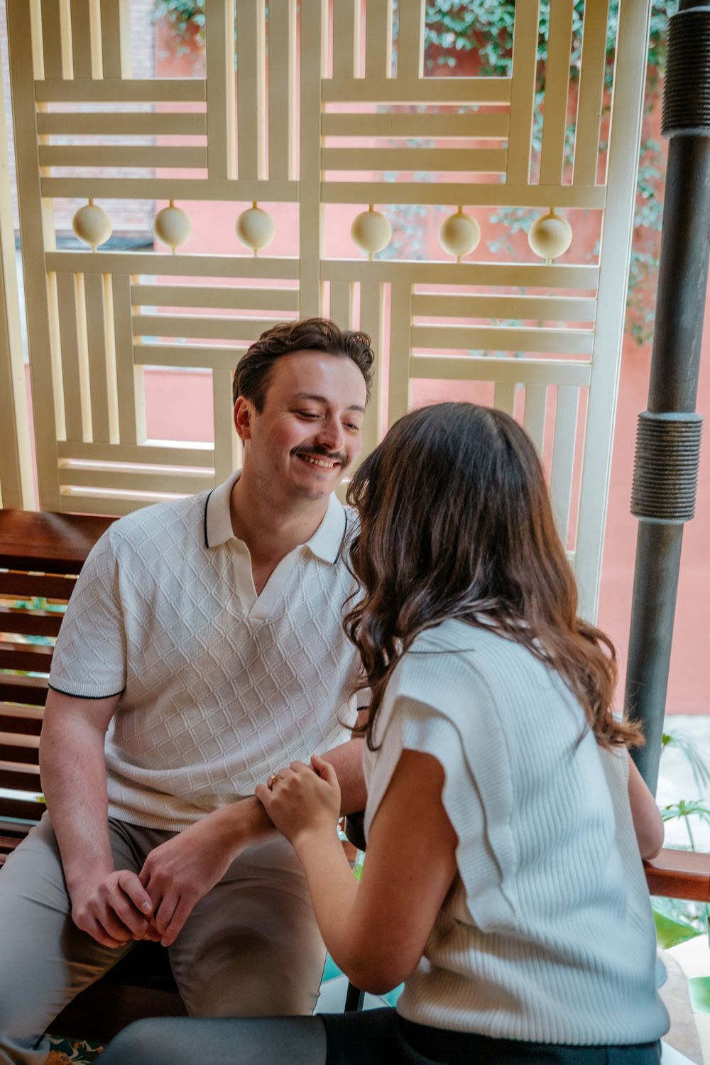 Couple hugging in Gaudí courtyard