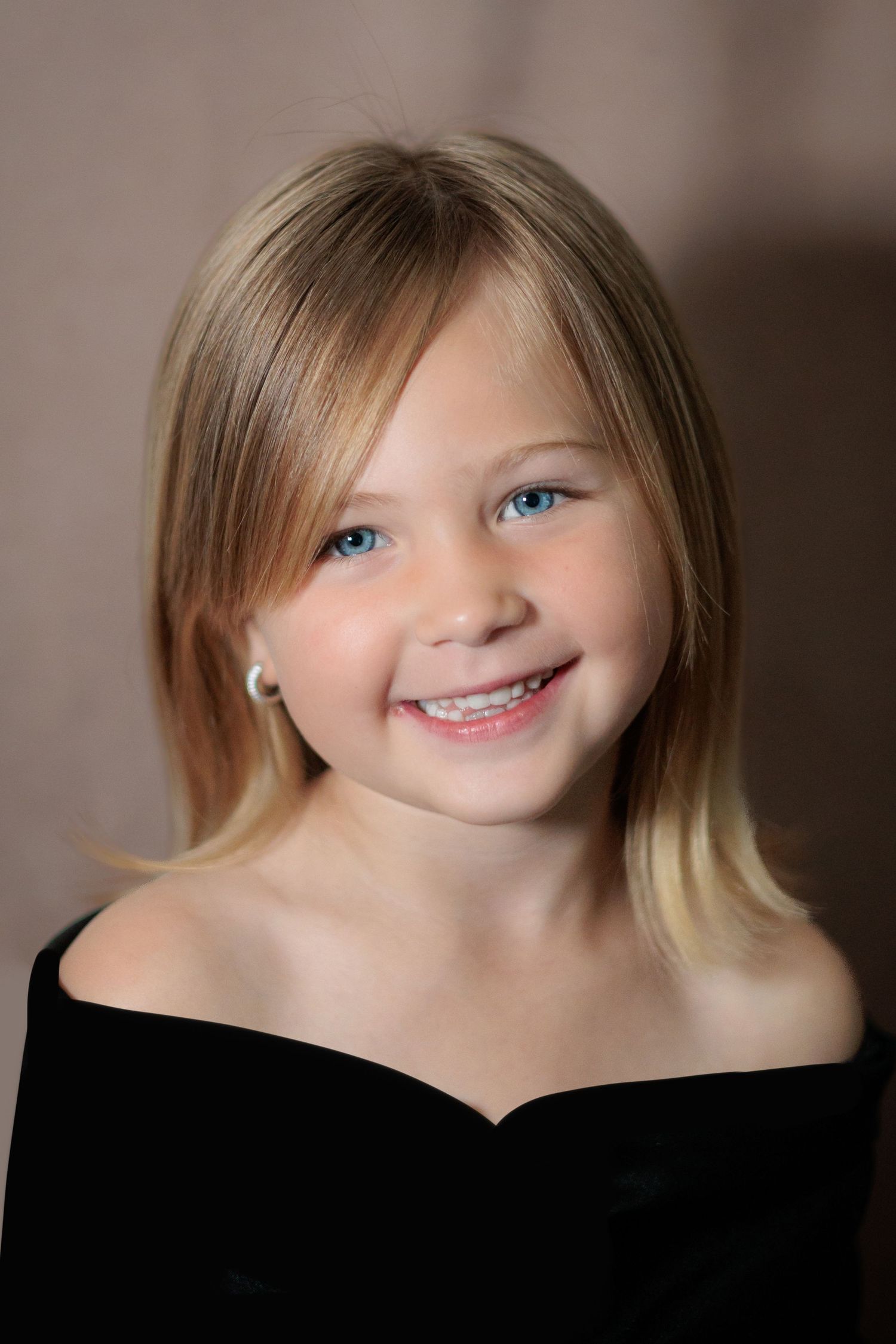 Studio portrait series featuring soft lighting and natural expressions.