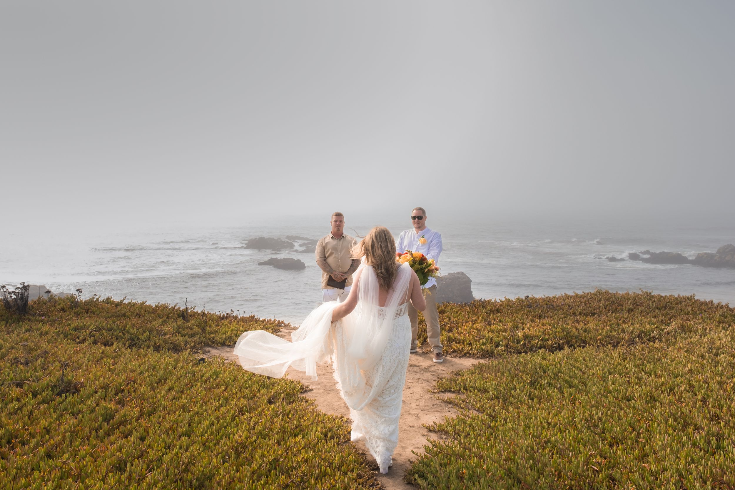 a wedding by the beach or cliff.