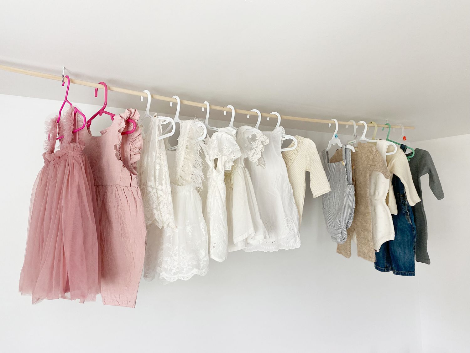 Variety of beautiful classic cake smash outfits in pinks, blues whites and neutrals for 1 year old babies and toddlers