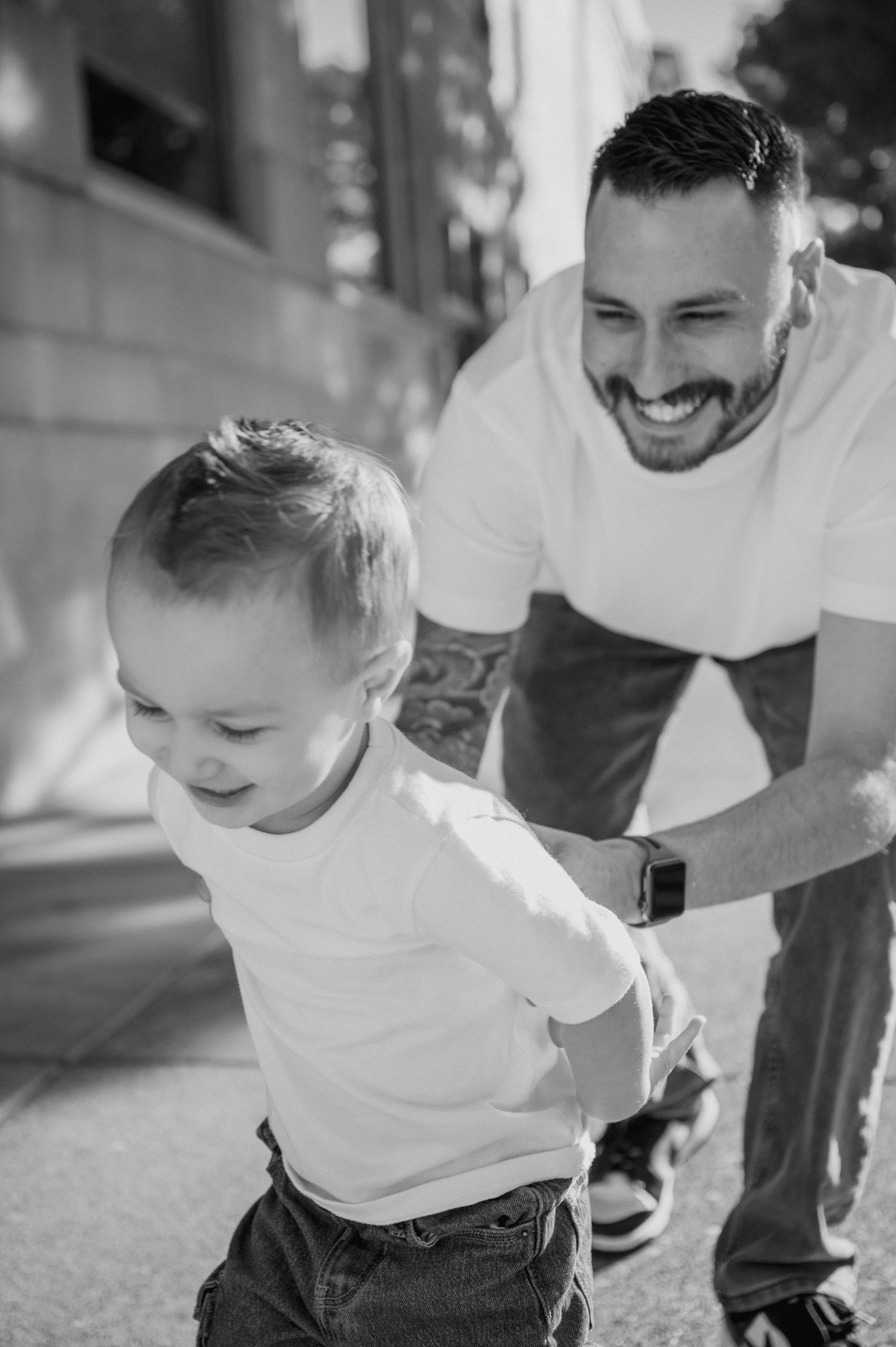 Dad chases son around downtown walla walla during family photos