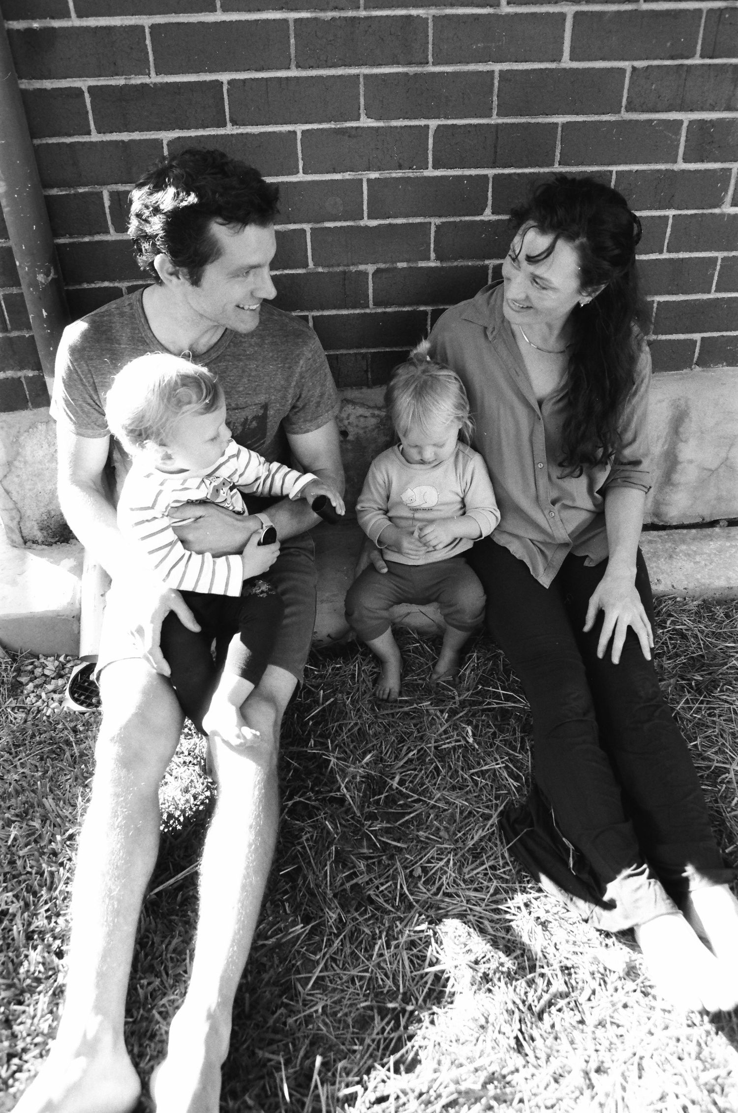 Authentic family photos of a Perth family with twins, captured during a playful backyard session.