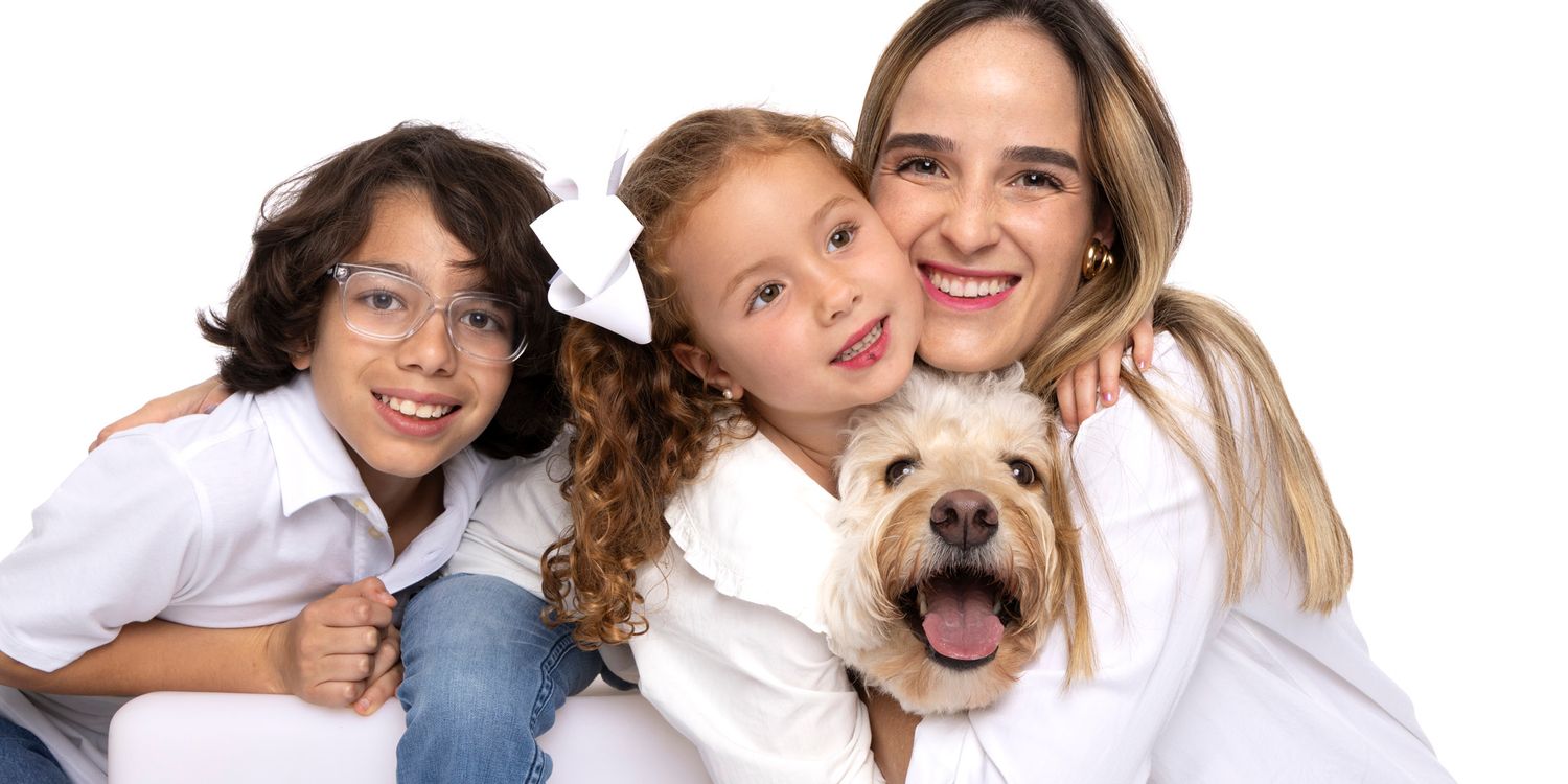 A series of family portrait photos showing affectionate poses with a dog against white backgrounds.