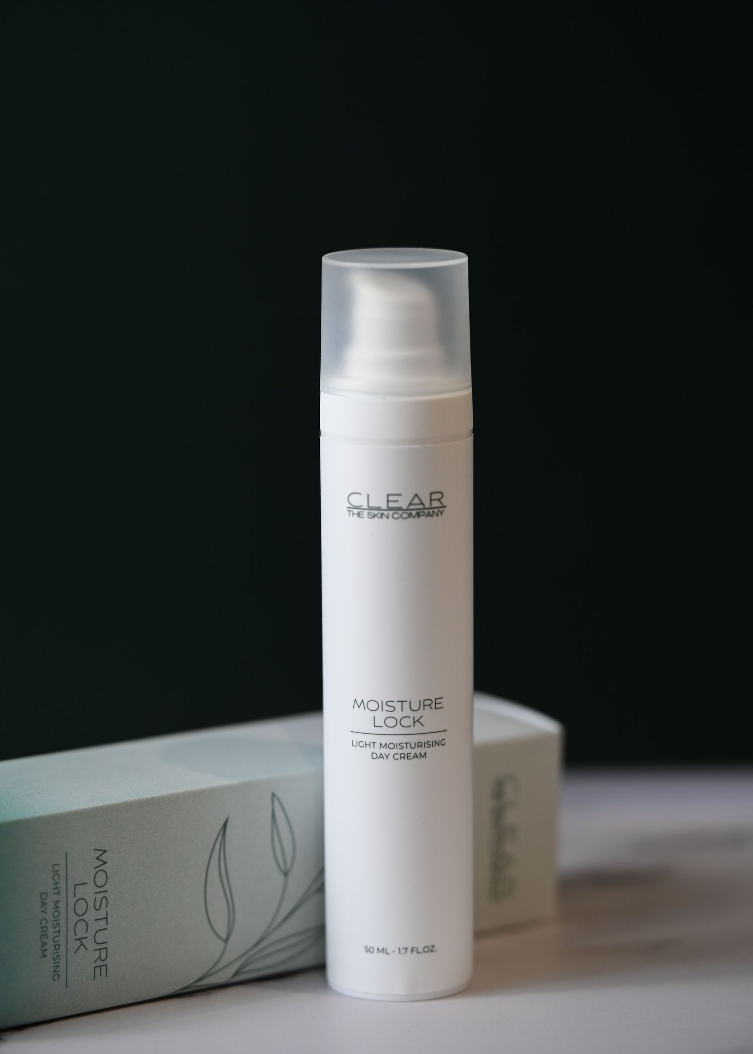 CLEAR The Skin Company Moisture Lock light moisturising day cream in white airless pump bottle with box.