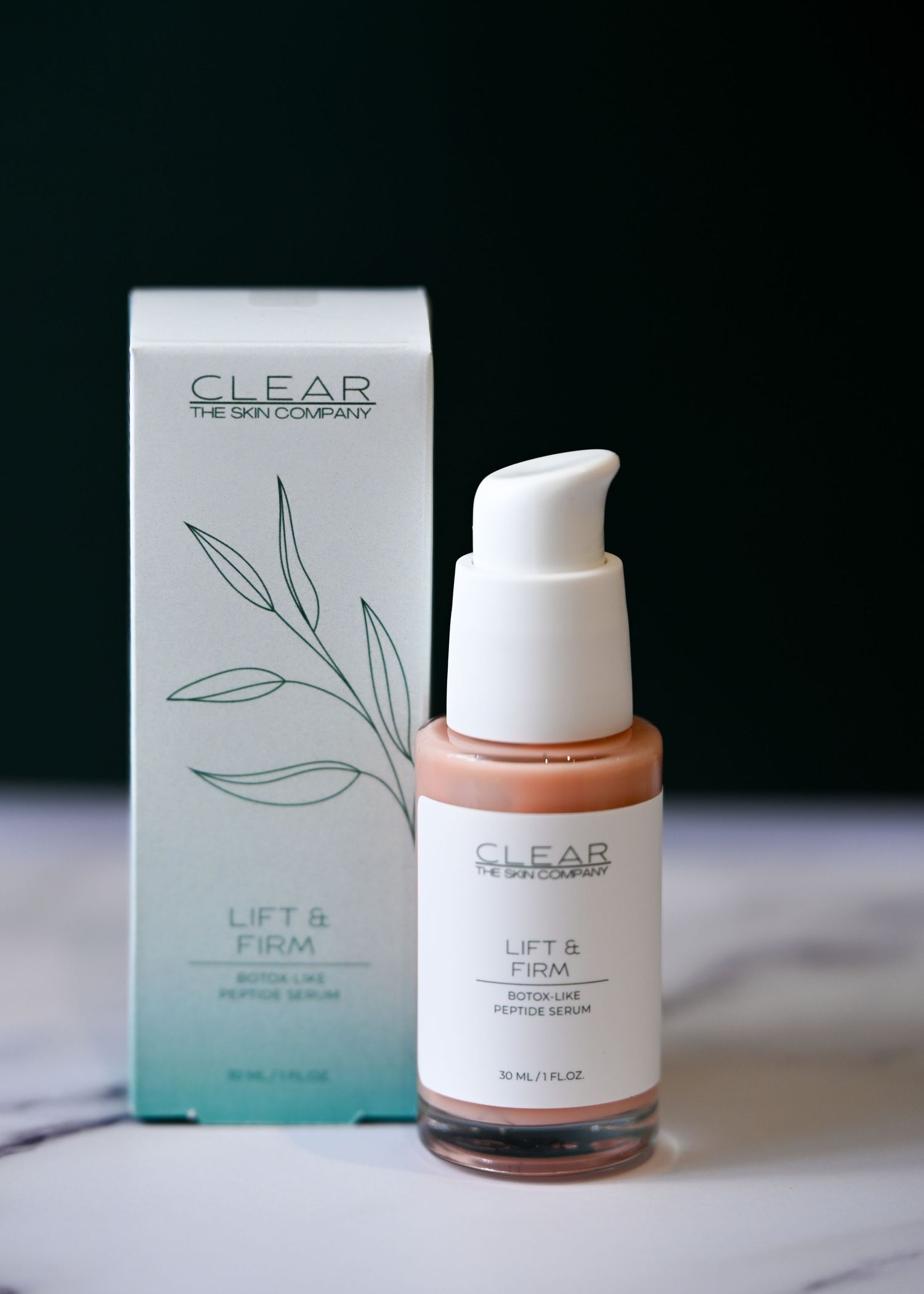 CLEAR The Skin Company Lift and Firm botox-like peptide serum in amber glass pump bottle with box.