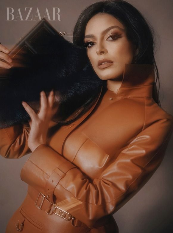 Editorial fashion series in warm sepia tones featuring leather clothing.
