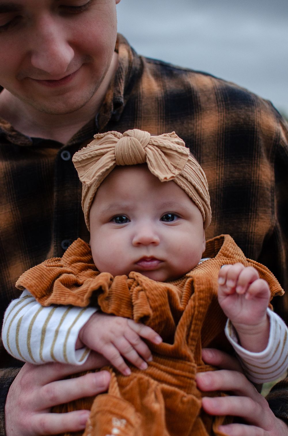Adorable baby being held by their Dad - Perth