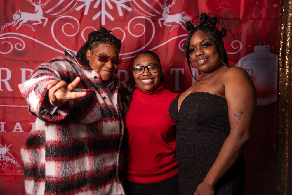 Holiday party photography with friends celebrating and exchanging gifts