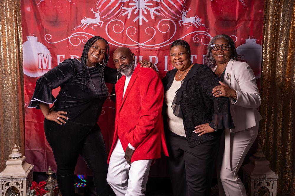 Holiday party photography with friends celebrating and exchanging gifts