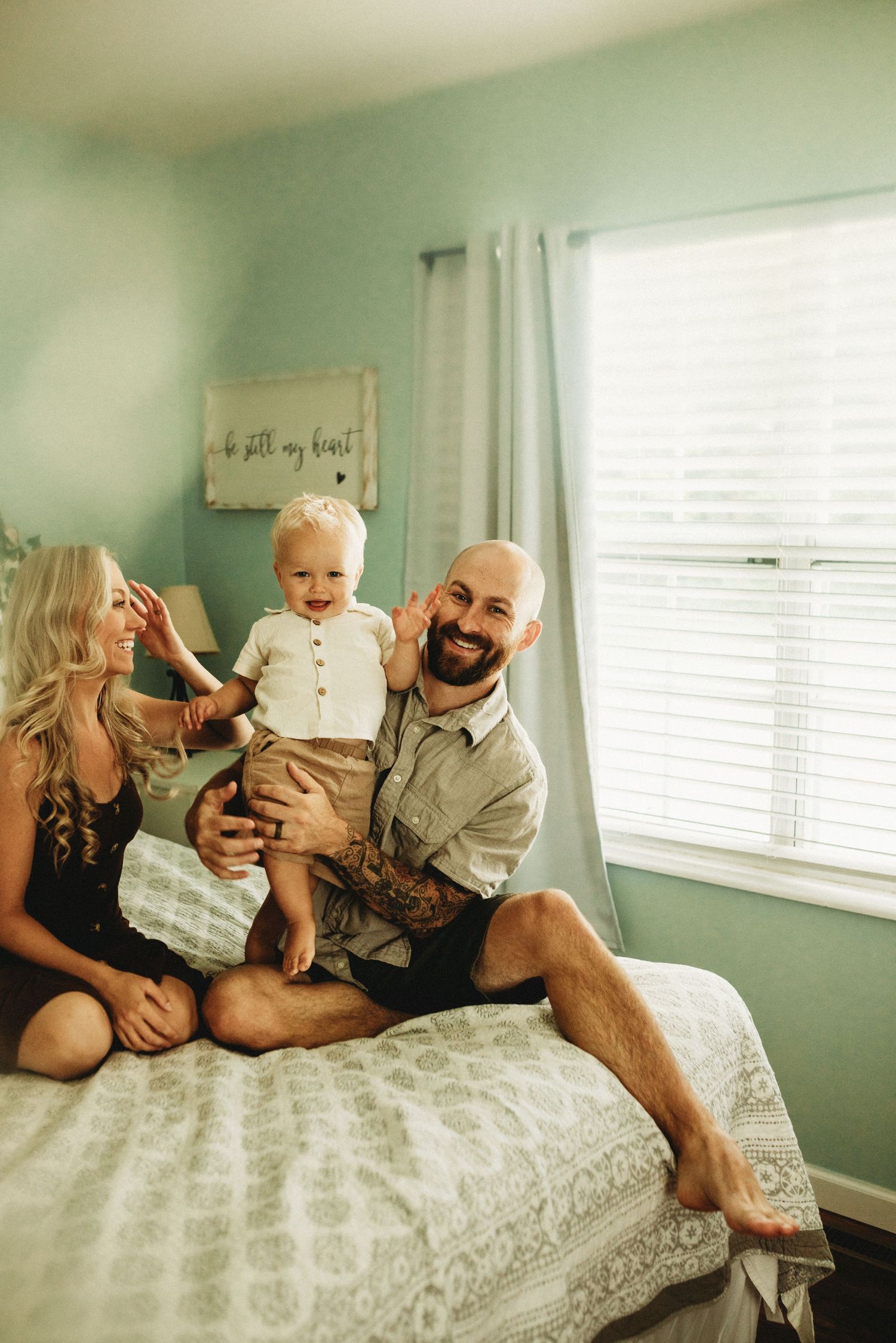 Mother is smiling at her son and husband
