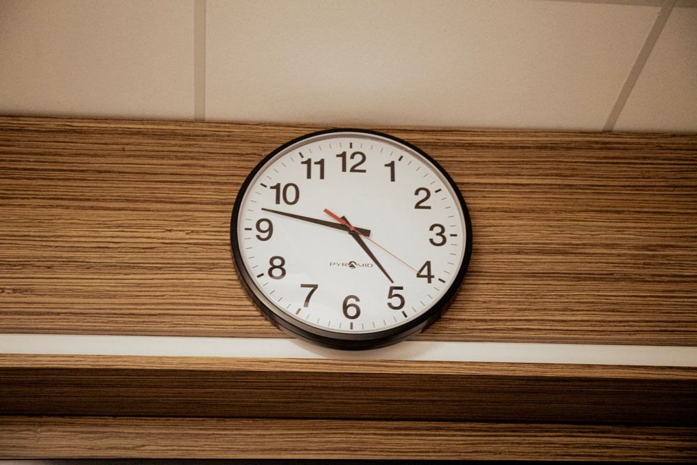Wall clock showing time in medical facility.