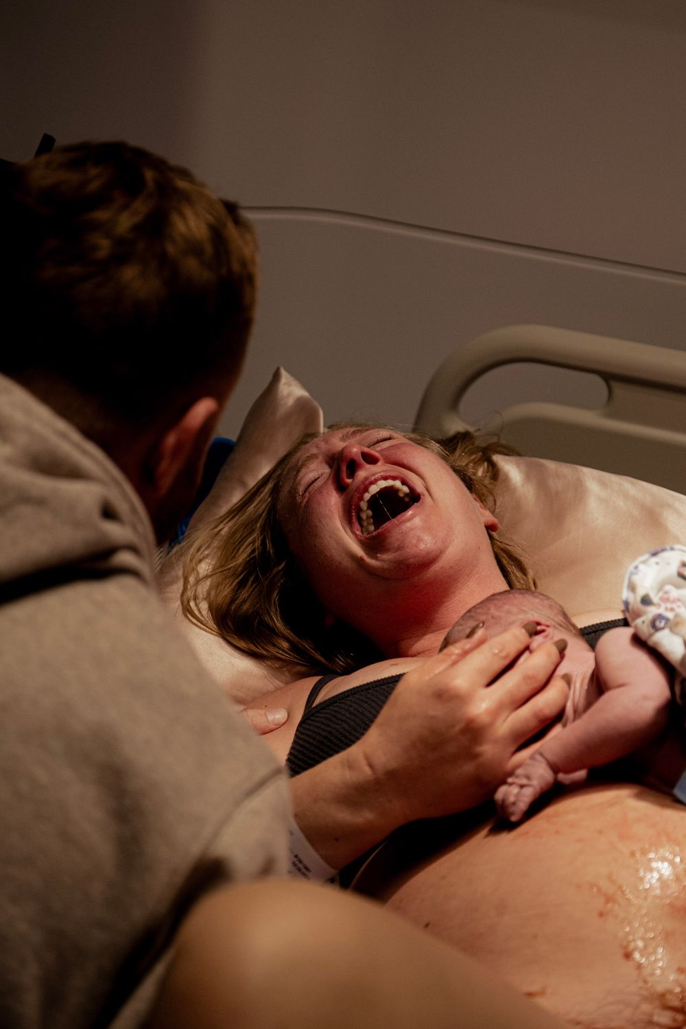 Emotional expression of pain or joy during medical procedure.