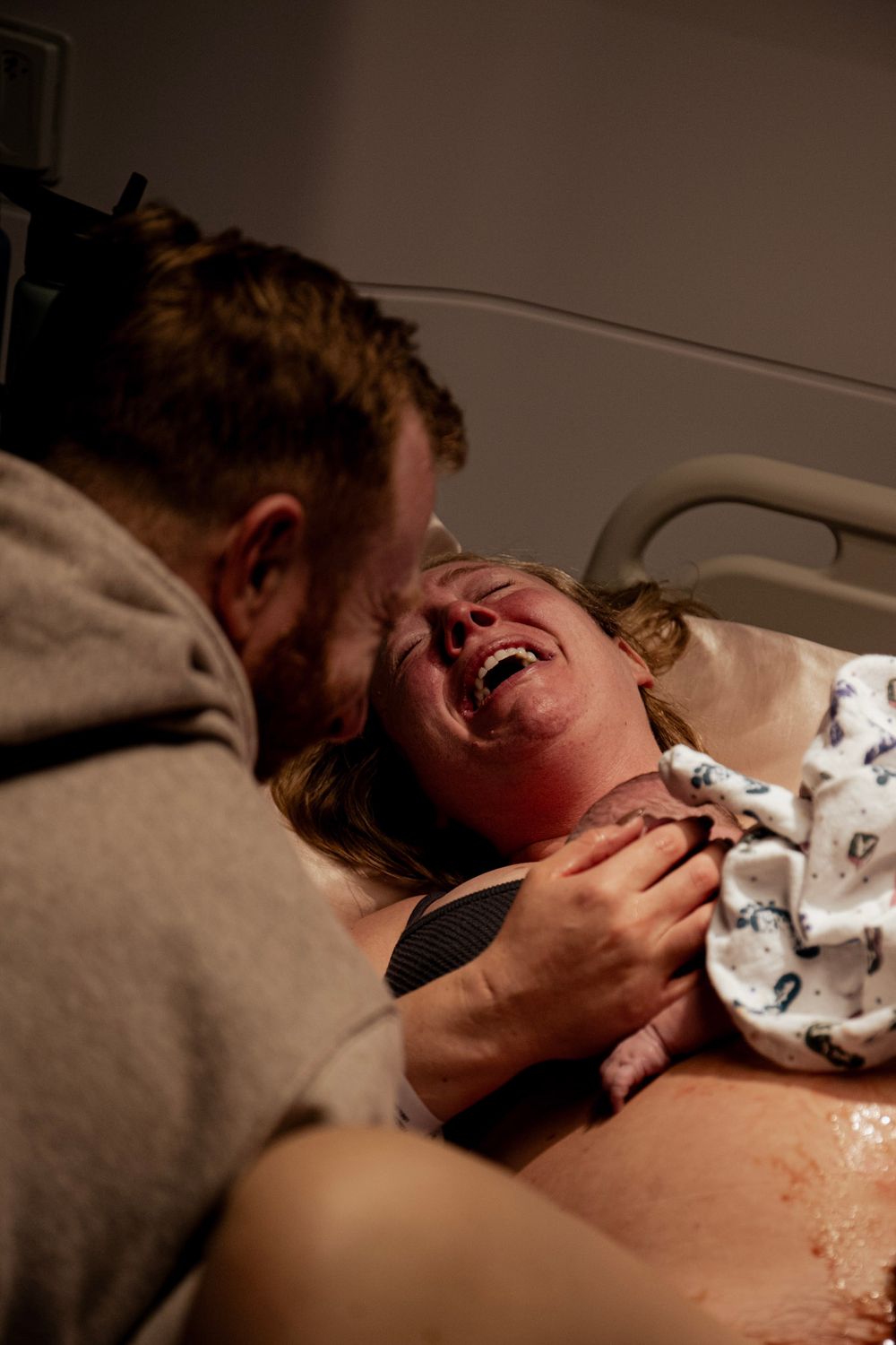 Patient experiencing intense moment during medical treatment.