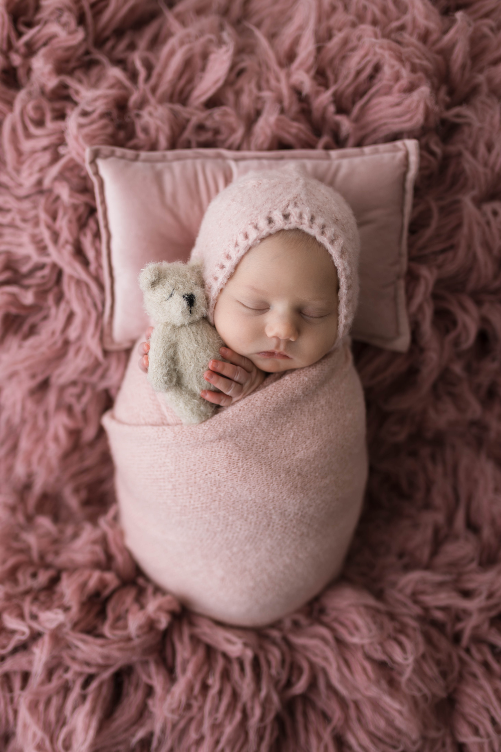 Newborn with lovie