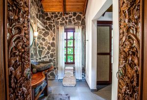 Spacious bathroom with traditional wooden accents and a luxury rustic style in Costa Rica
