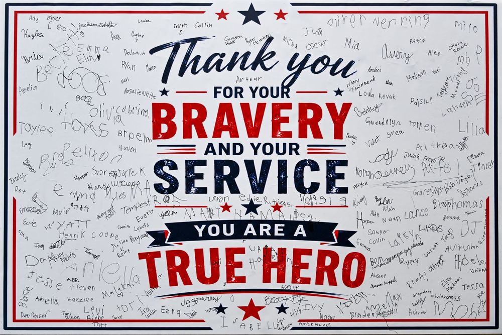 Thank you for your bravery and service, you are a true hero sign with signatures.