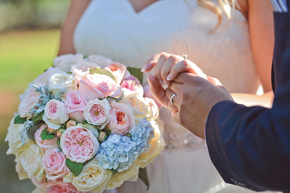 groom holding brides hand and bouquet - Kelly Chapman Photographer Perth