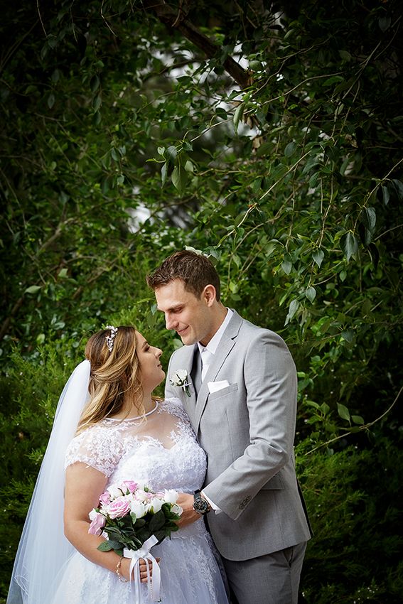 Bride and groom with greenery in background - Kelly Chapman Photographer Perth