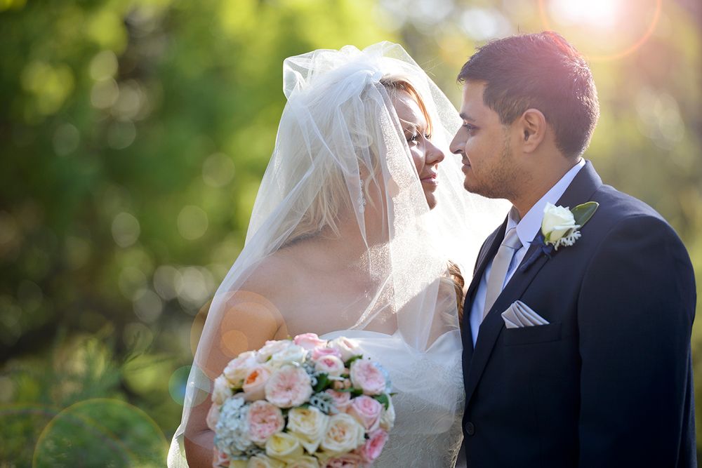 bride and groom with beautiful sun flare in photo - Kelly Chapman Photographer Perth