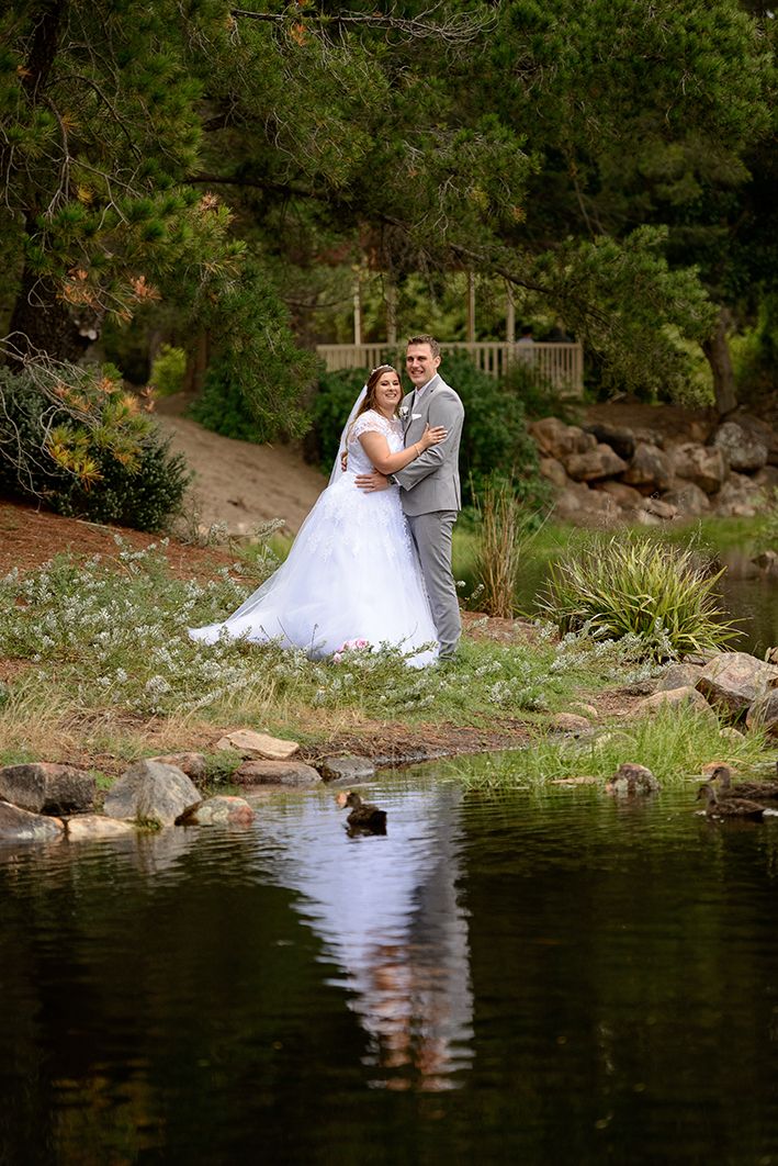 Bride and groom by the lake with reflection - Kelly Chapman Photographer Perth