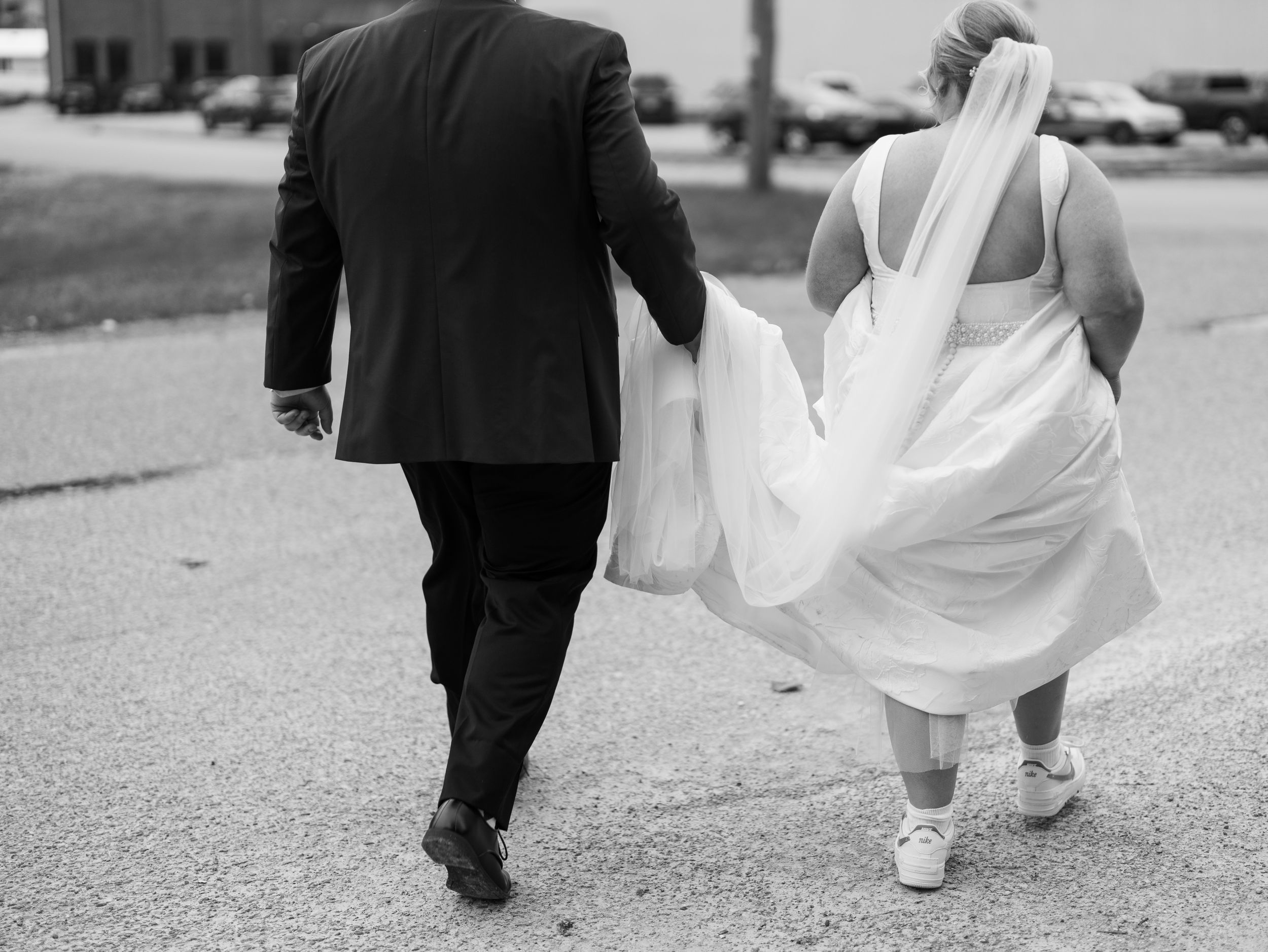 A black and white sequence of photos showing a bride and groom walking away together after their wedding ceremony.