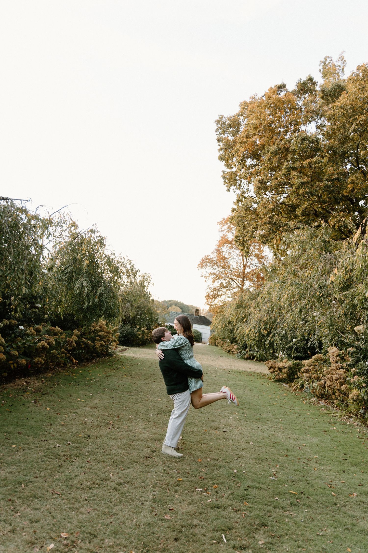 A sequence of action shots shows a person doing a backflip on a grassy hillside during autumn.