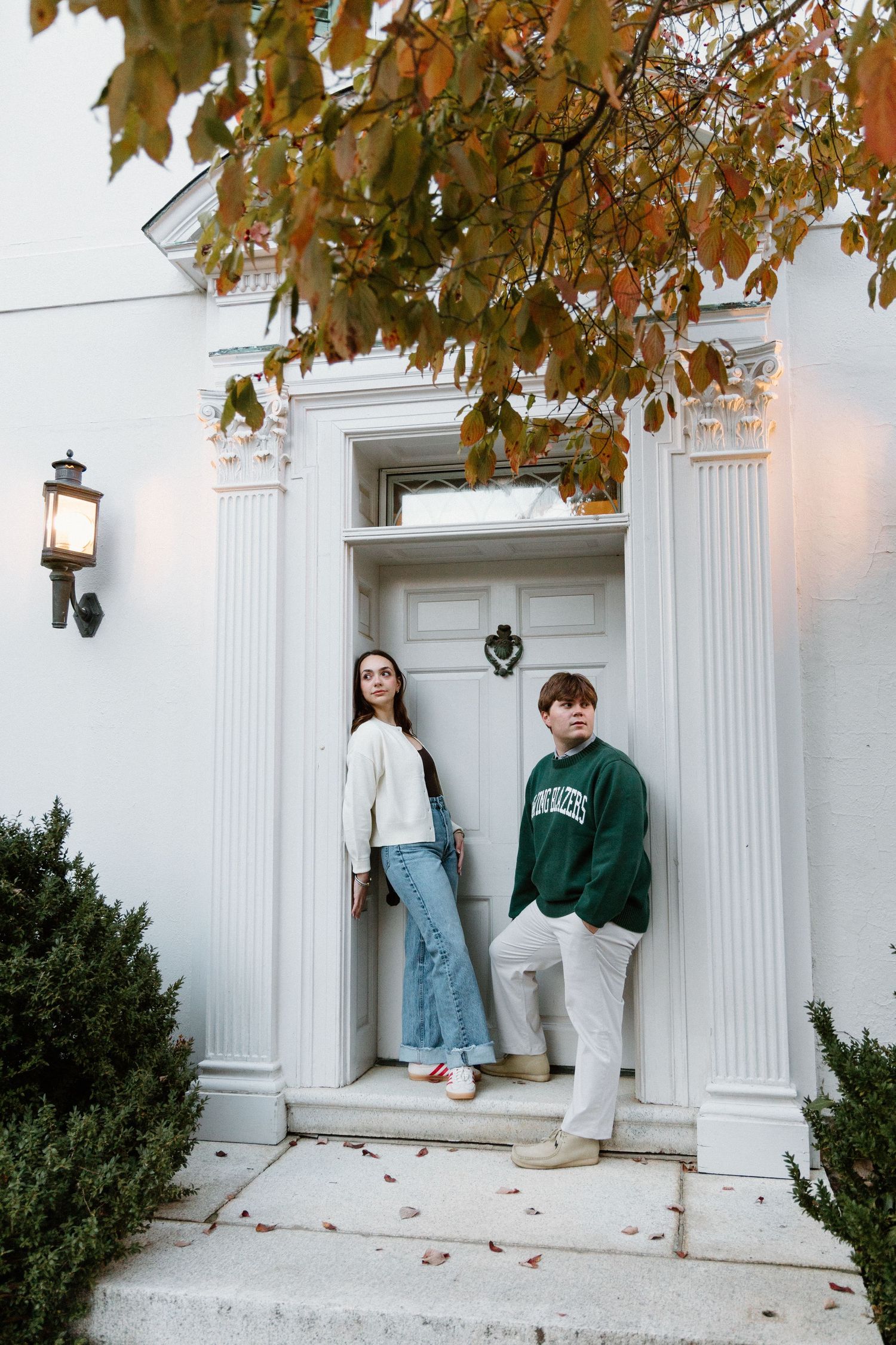 A series of lifestyle photos showing someone sitting on white columns during autumn with fallen leaves on the ground.