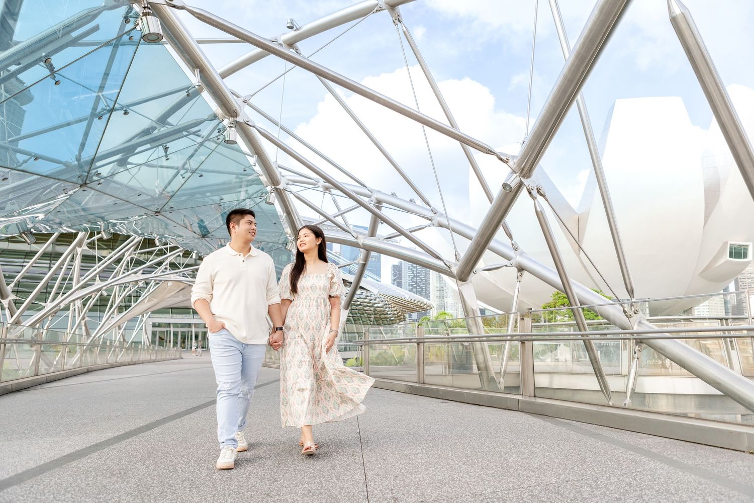 sunrise pre-wedding photos of filipino couple in singapore on the helix bridge with Marina Bay sands & art science museum