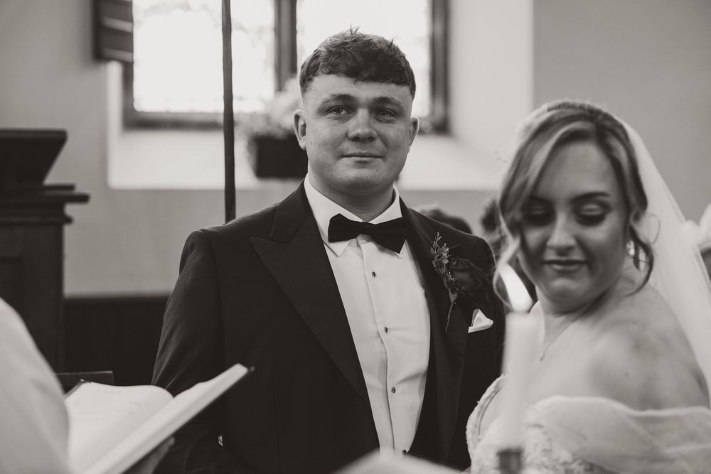 A black and white photo strip showing a couple in formal wedding attire in four different poses.